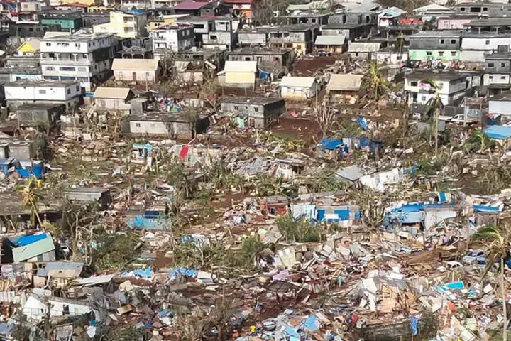 Emmanuel Macron vows to visit cyclone-hit Mayotte