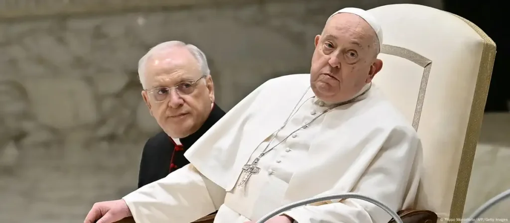 a man in a white robe sitting next to a man in a black robe