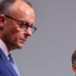 Macron urges French lawmakers to adopt German-style cooperation as government faces budget crisis