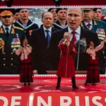 Putin criticizes sanctions as he prepares for visit to China