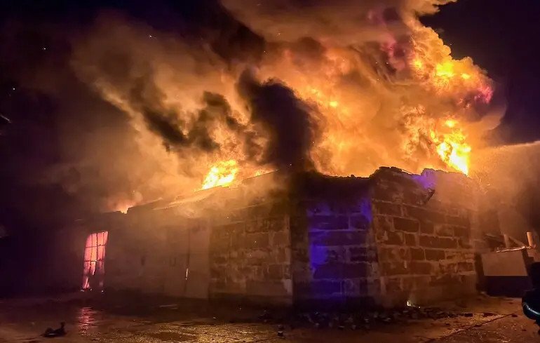 Russian drones ignite large fire at warehouses in Odesa, Ukraine